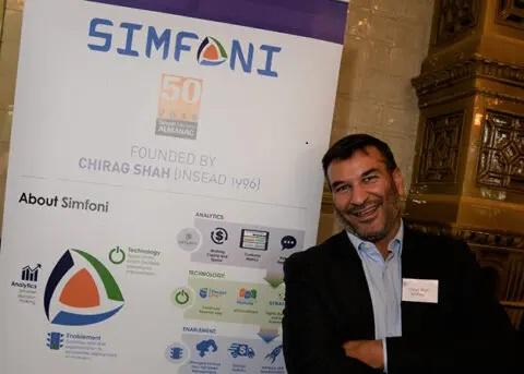 Image of man in front of Simfoni banner